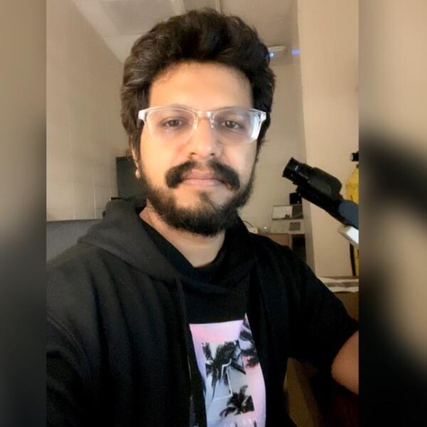 Surjeet at microscope